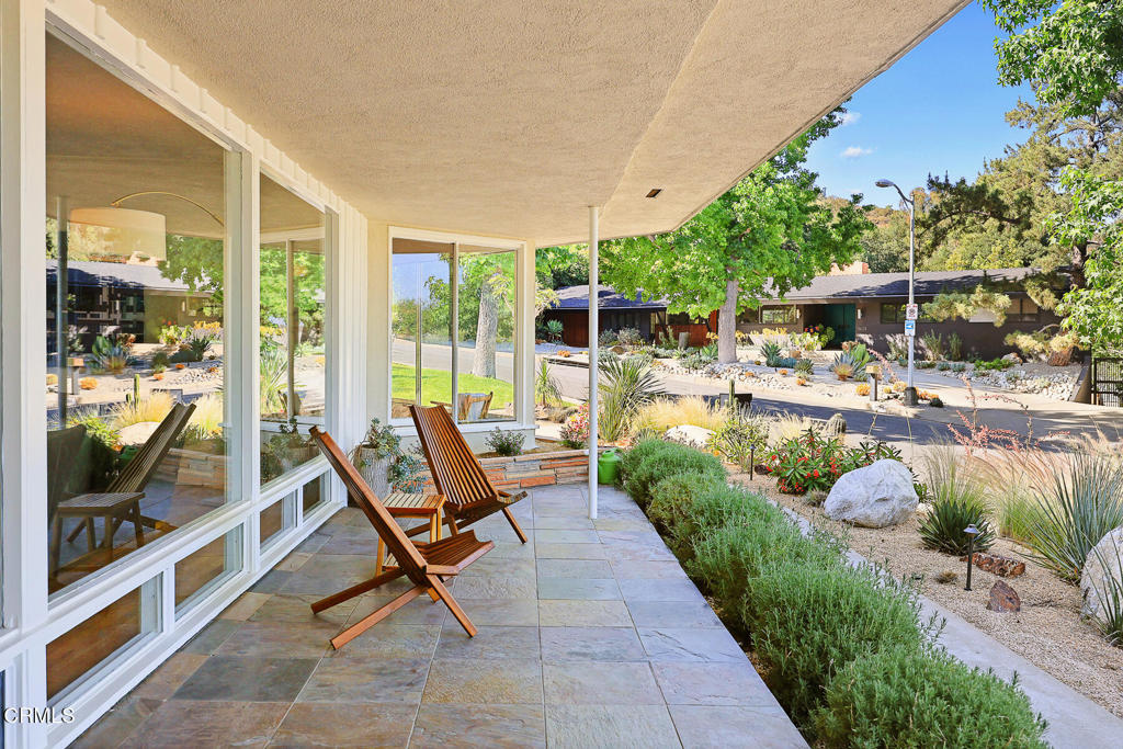 1620 Knollwood Drive Pasadena, CA 91103 - Photo 50 of 59 a view of a chair and tables in the patio next to a yard