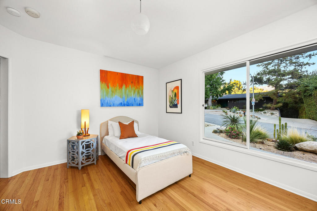 1620 Knollwood Drive Pasadena, CA 91103 - Photo 10 of 59 a bedroom with a bed and a large window