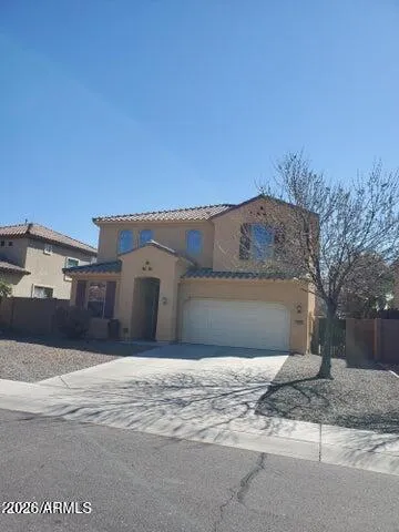 a view of a house with a snow on the road