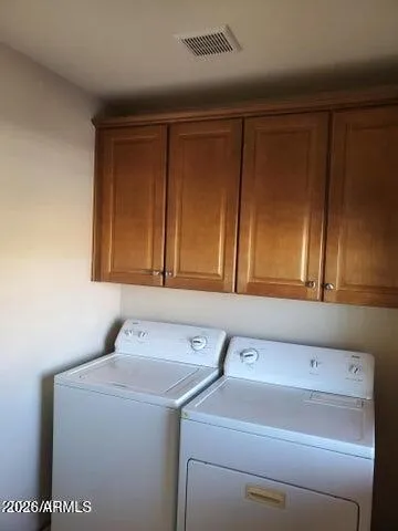 a view of backyard with outdoor seating and green space