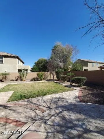 a view of a back yard of the house
