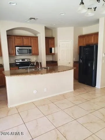 a kitchen with a sink and a refrigerator