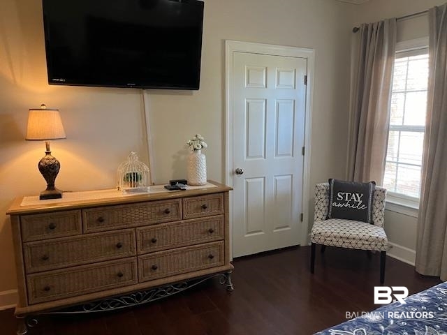 450 Park Avenue, Unit 112 Foley, AL 36535 - Photo 11 of 20 Bedroom with dark wood-type flooring and baseboards