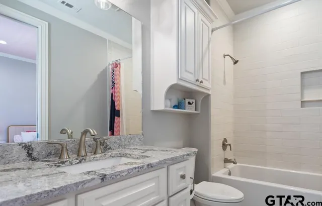 a view of bedroom with furniture and wooden floor