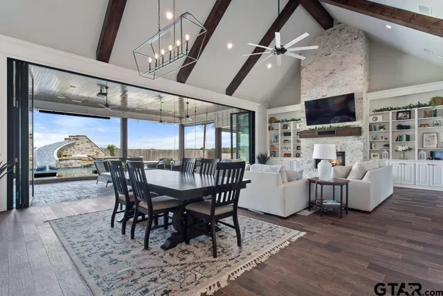 a living room with fireplace furniture and a flat screen tv