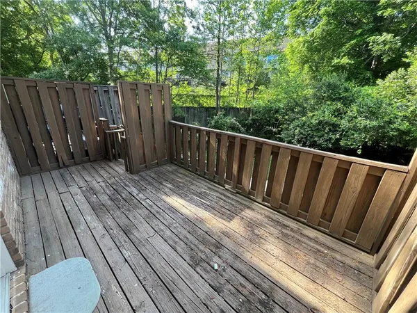 a view of balcony with wooden floor