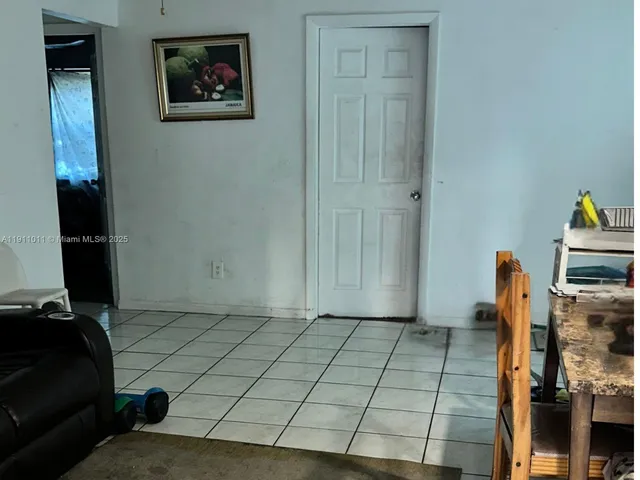 a view of a utility room with closet