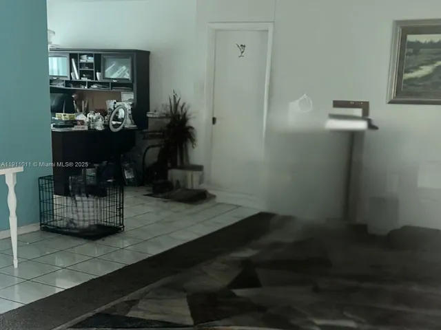 a room with water heater and wooden shelves