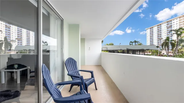 a view of a room with furniture and wooden floor