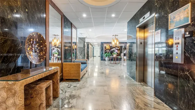 a view of lobby with livingroom and furniture