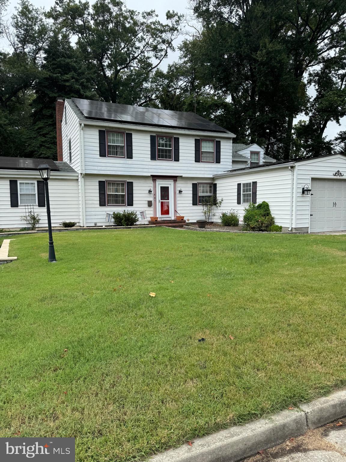 4 Grove Street Carneys Point, NJ 08069 - Photo 2 of 6 a view of a house with a yard and sitting area