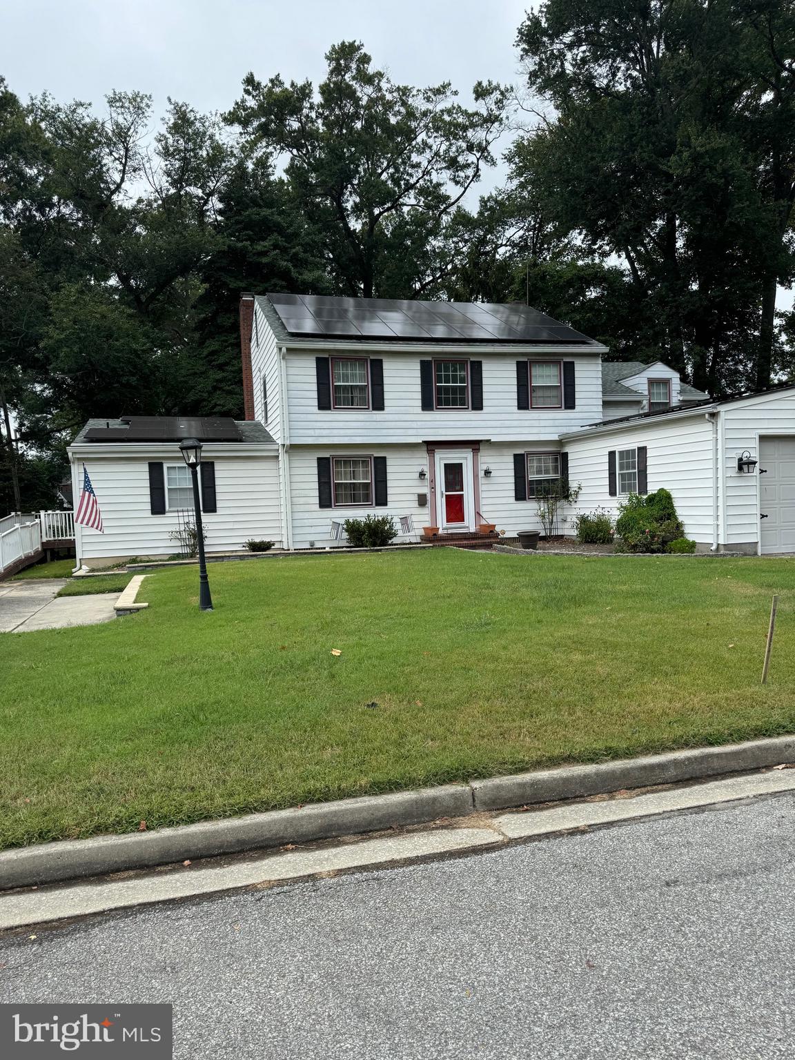 4 Grove Street Carneys Point, NJ 08069 - Photo 4 of 6 a swimming pool with lots of trees in the background