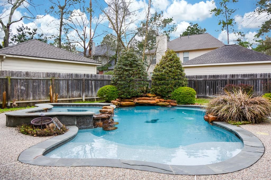 27 West Rumple Creek Place Spring, TX 77381 - Photo 30 of 32 Go for a swim on hot Summer days or soak up the sun next to this amazing view.