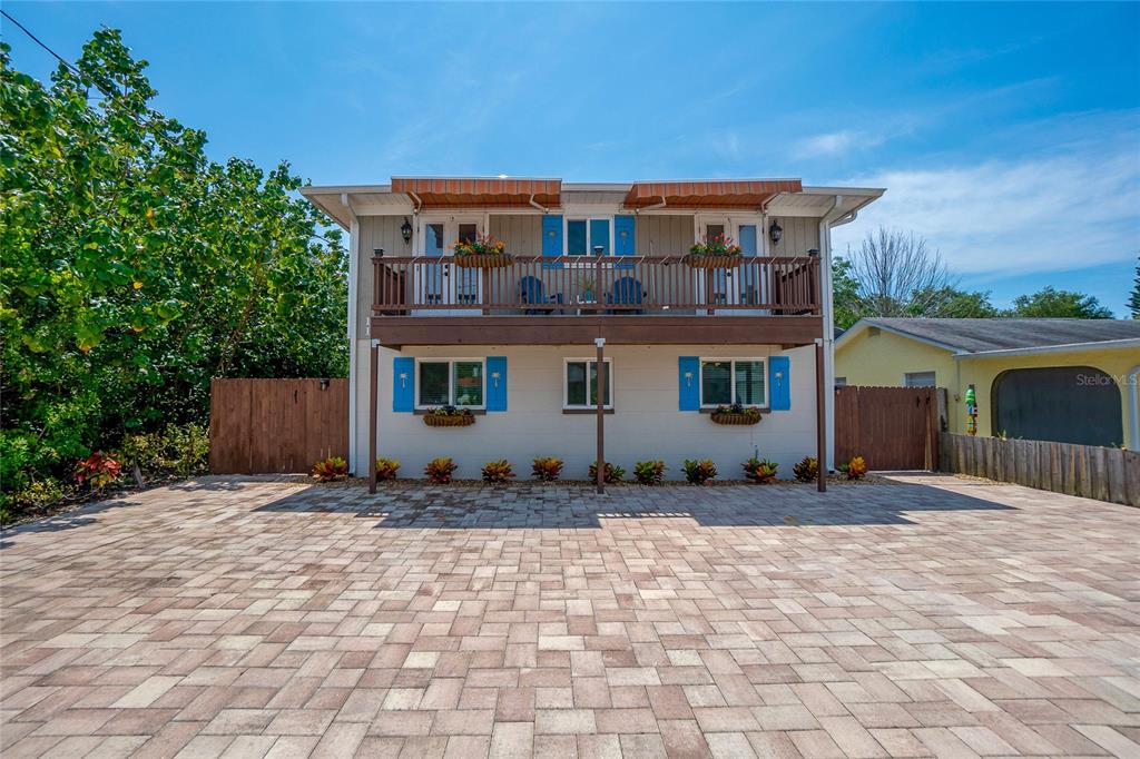 1803 Manasota Beach Road Englewood, FL 34223 - Photo 1 of 1 a front view of a house with a wooden fence