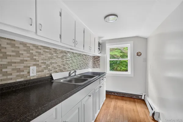 a kitchen with a sink and cabinets