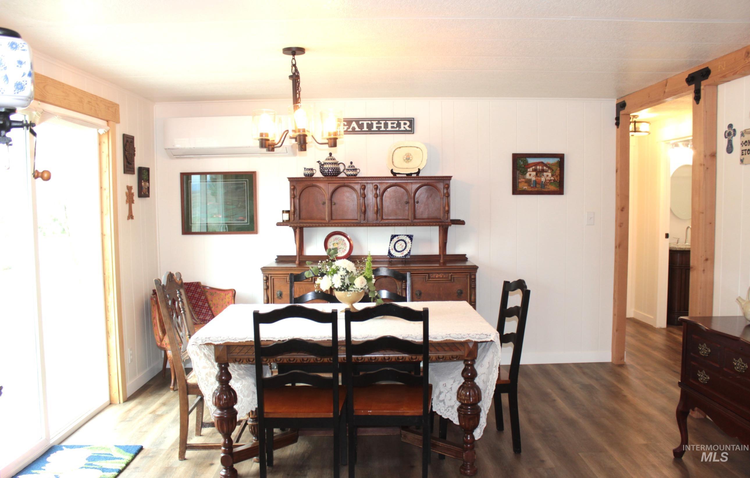 1824 Dutch Flat Road Midvale, ID 83645 - Photo 13 of 41 Dining area with dark wood-type flooring and hanging lights