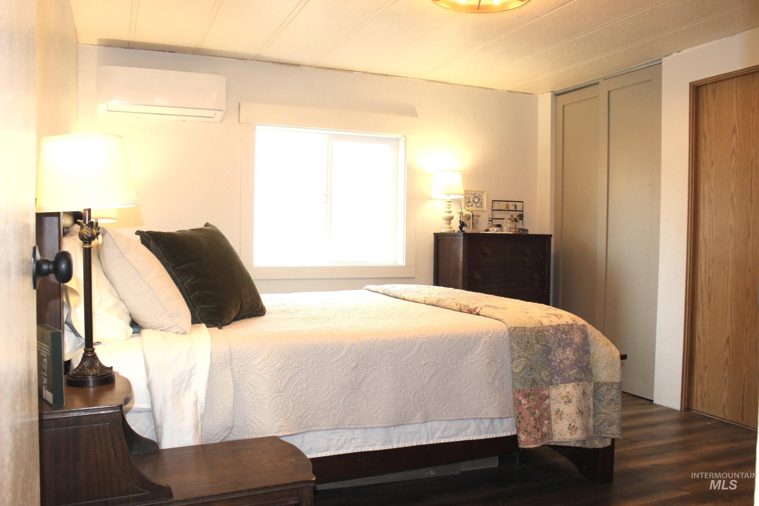 1824 Dutch Flat Road Midvale, ID 83645 - Photo 14 of 41 Bedroom with a wall mounted mini split and wood finished floors