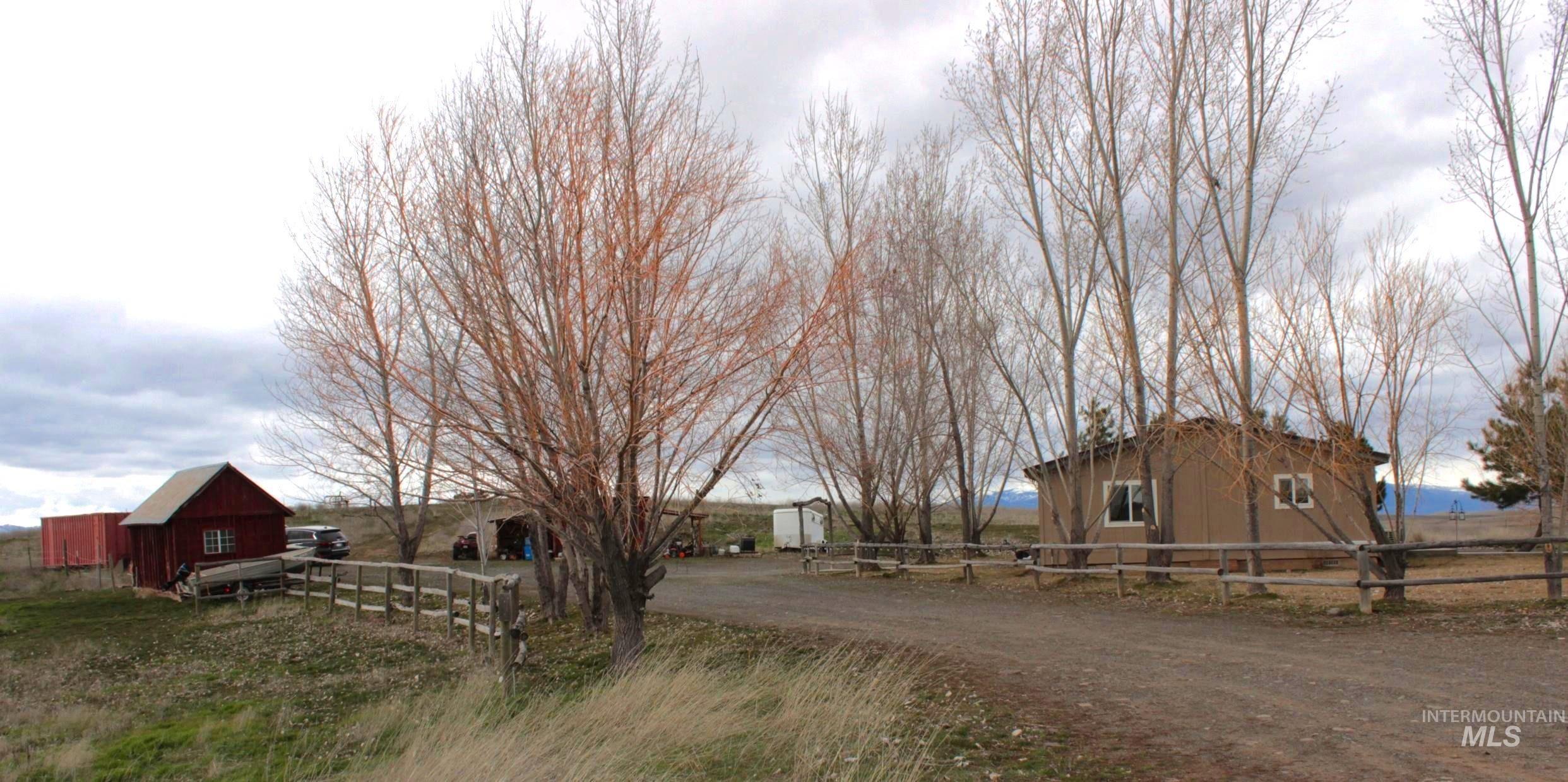 1824 Dutch Flat Road Midvale, ID 83645 - Photo 29 of 41 View of dirt / gravel road featuring out buildings, home and yard and a view of rural / pastoral area