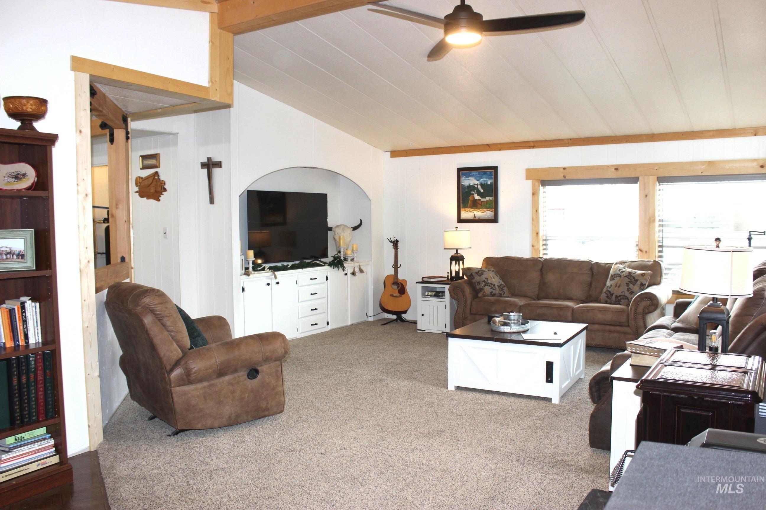 1824 Dutch Flat Road Midvale, ID 83645 - Photo 9 of 41 Carpeted living room with a ceiling fan and lofted ceiling