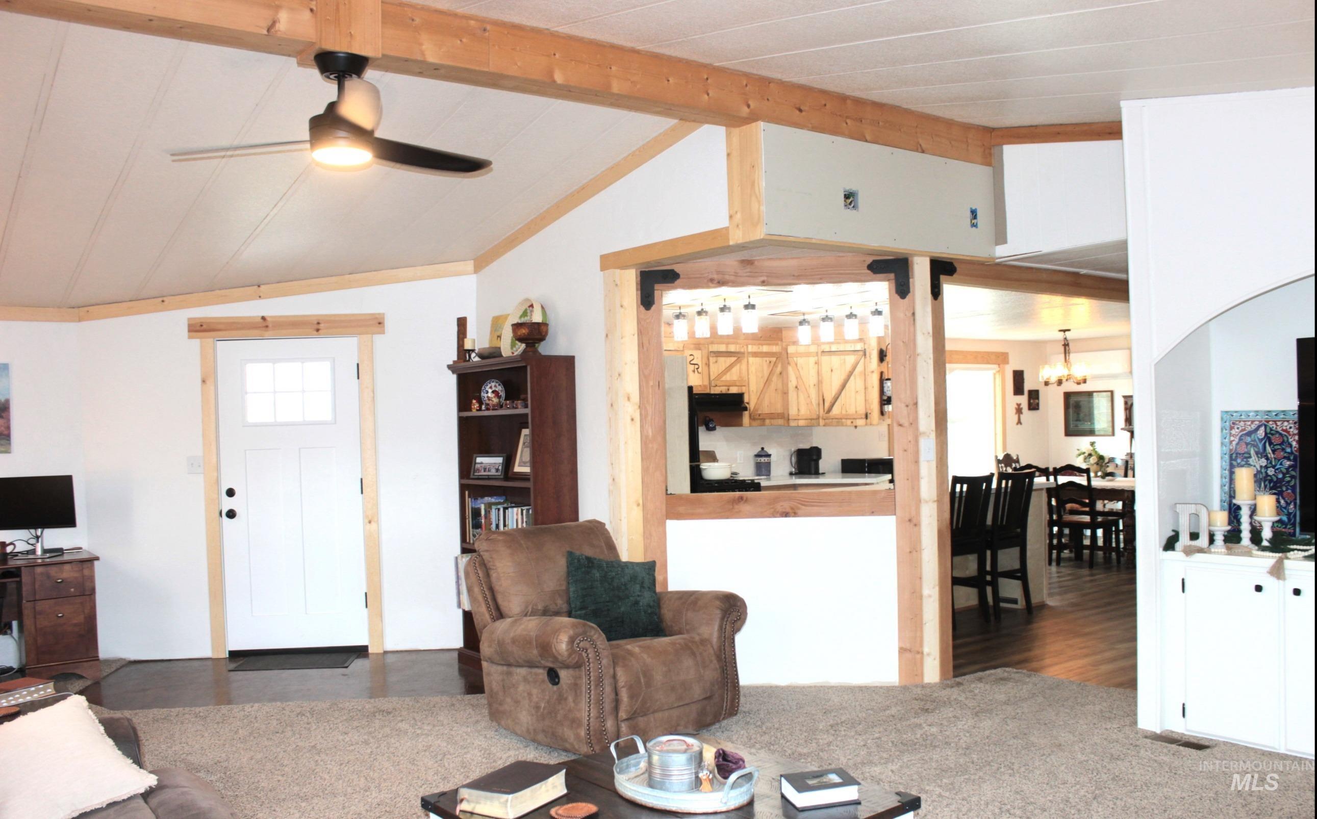 1824 Dutch Flat Road Midvale, ID 83645 - Photo 10 of 41 Living area featuring ceiling fan and vaulted ceiling with beams