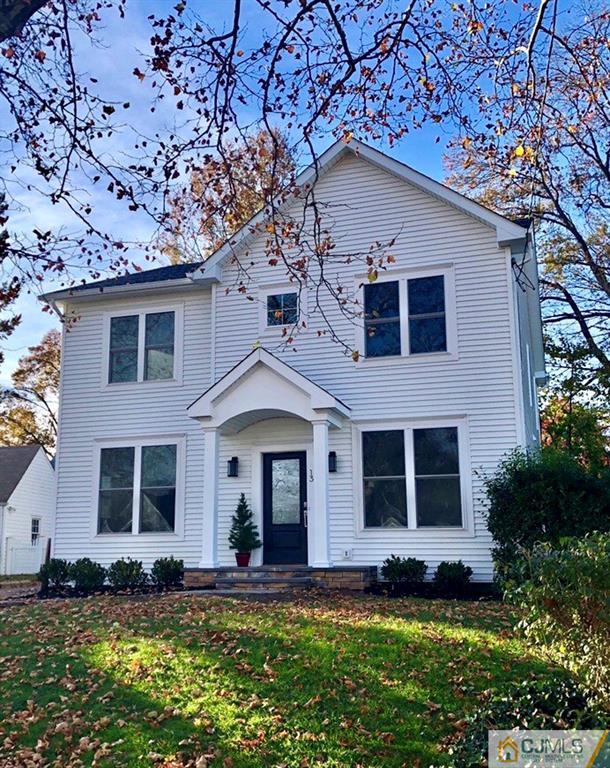 13 Cherokee Road Cranford, NJ 07016 - Photo 1 of 25 a front view of a house with a yard