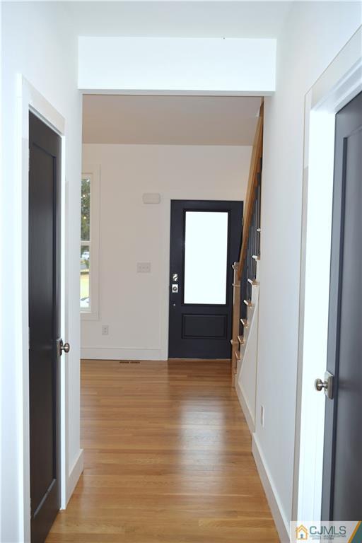 13 Cherokee Road Cranford, NJ 07016 - Photo 2 of 25 a view of a hallway with wooden floor