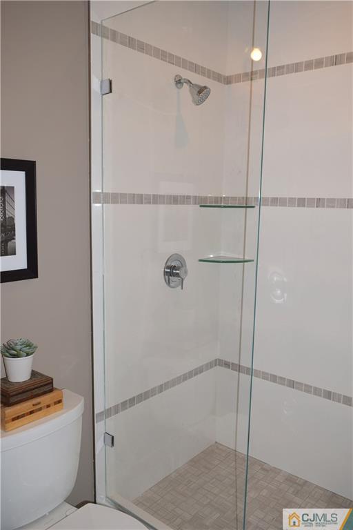13 Cherokee Road Cranford, NJ 07016 - Photo 11 of 25 a bathroom with a shower and toilet