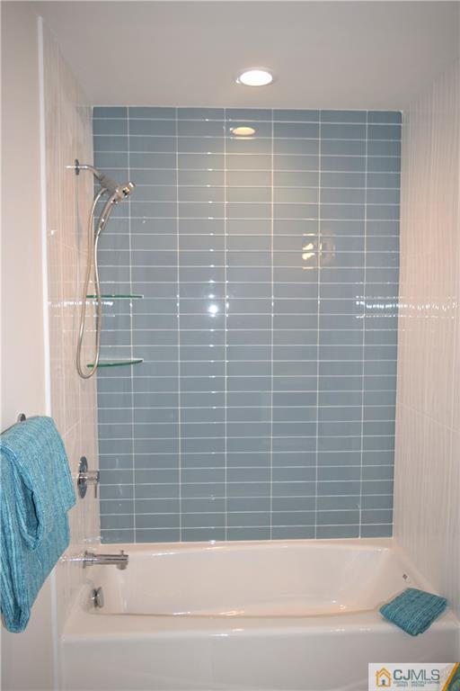 13 Cherokee Road Cranford, NJ 07016 - Photo 17 of 25 a bathroom with a bathtub and a shower