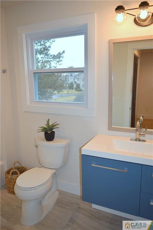 13 Cherokee Road Cranford, NJ 07016 - Photo 18 of 25 a bathroom with a toilet sink and mirror