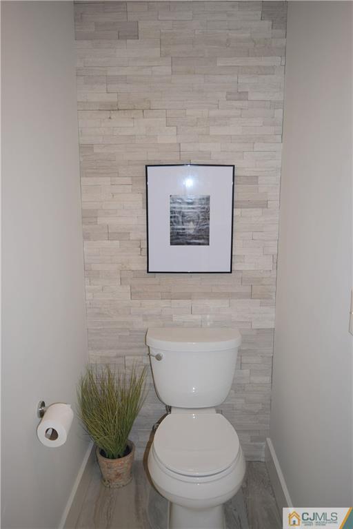 13 Cherokee Road Cranford, NJ 07016 - Photo 20 of 25 a bathroom with a toilet and a potted plant