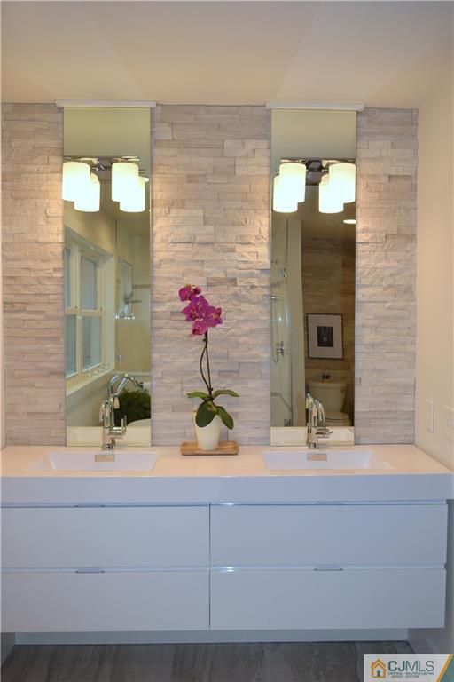 13 Cherokee Road Cranford, NJ 07016 - Photo 21 of 25 a bathroom with a sink and a mirror