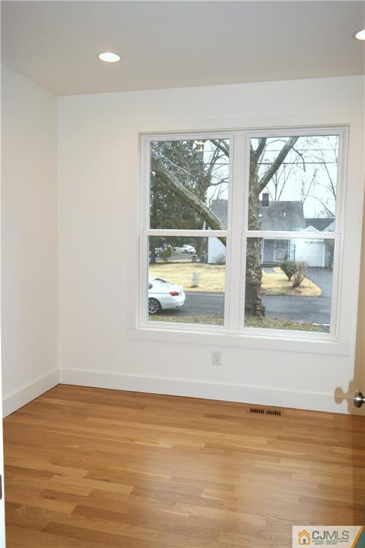 13 Cherokee Road Cranford, NJ 07016 - Photo 9 of 25 a view of a room with wooden floor and a window
