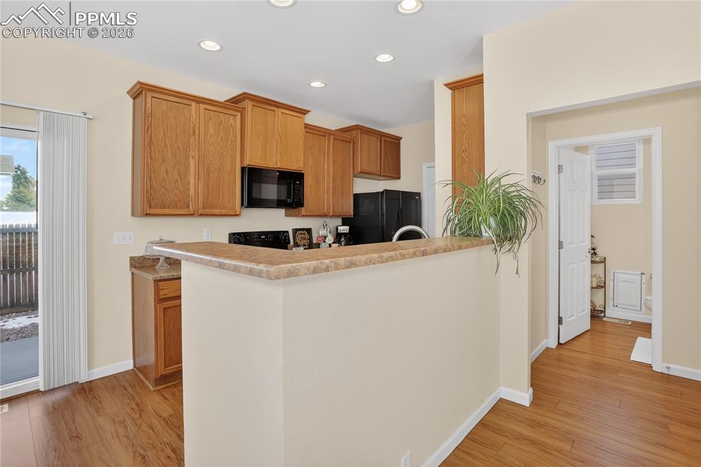 7682 Capel Point Peyton, CO 80831 - Photo 8 of 24 Breakfast bar for barstool seating