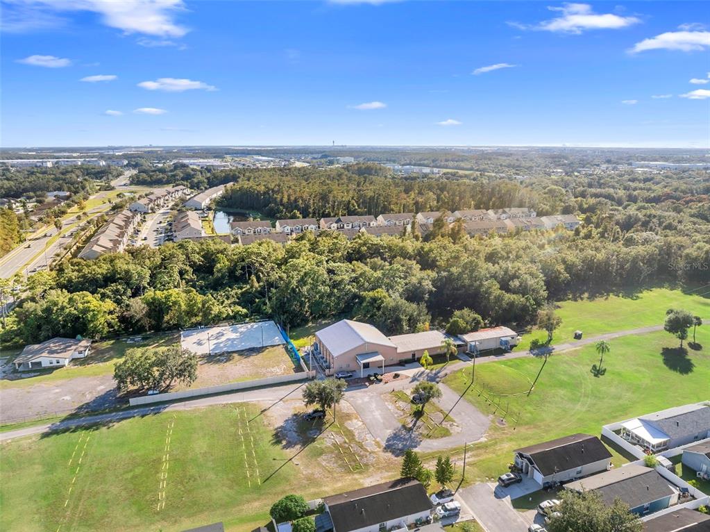 4170 South Goldenrod Road Orlando, FL 32822 - Photo 5 of 21 an aerial view of a house with a lake view