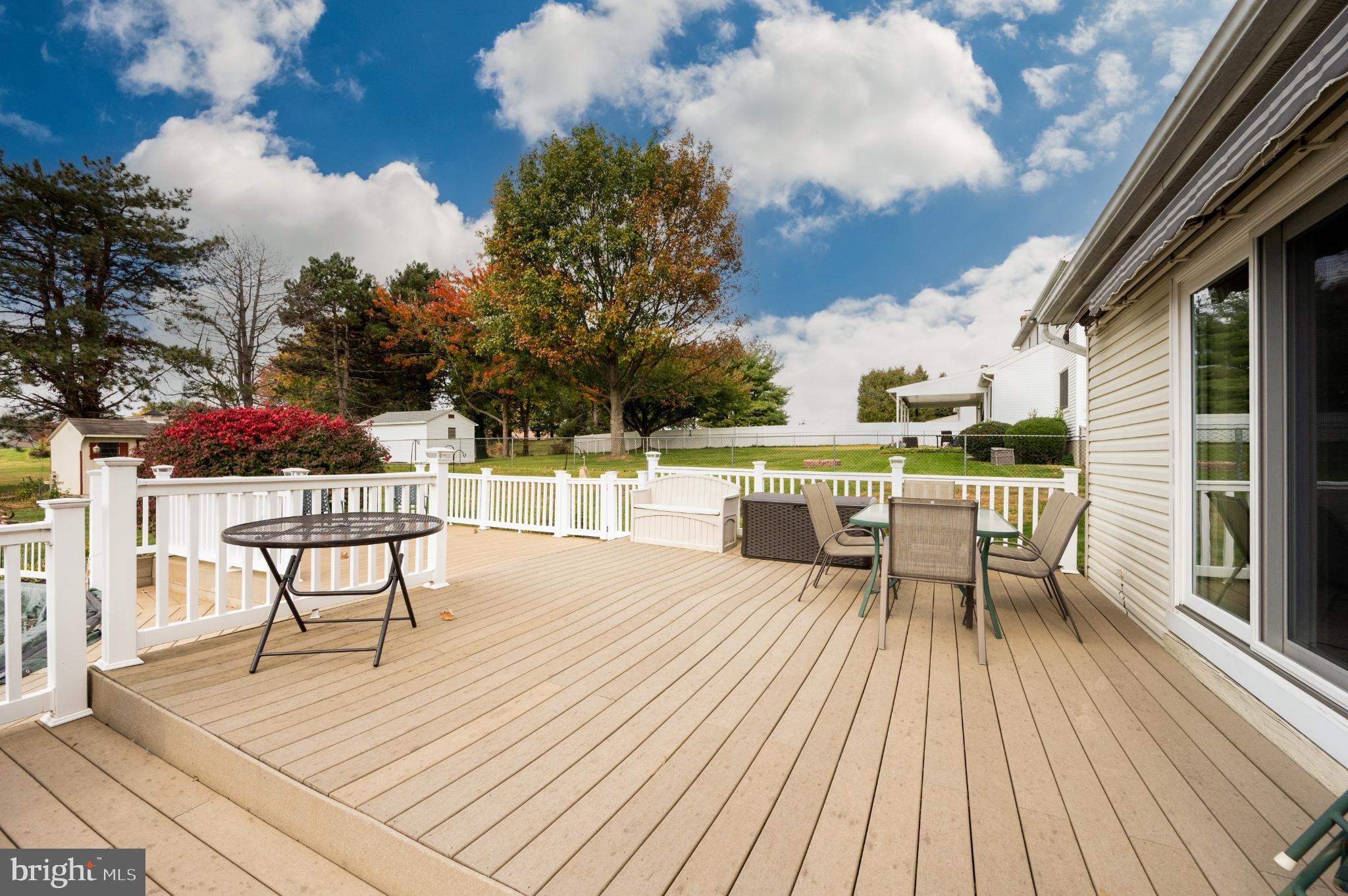 1052 Boeshore Circle Reading, PA 19605 - Photo 11 of 72 Sunny deck with vibrant autumn scenery.