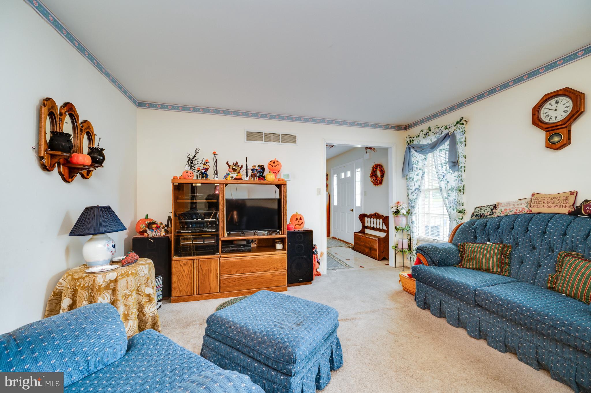 1052 Boeshore Circle Reading, PA 19605 - Photo 24 of 72 a living room with furniture and a flat screen tv