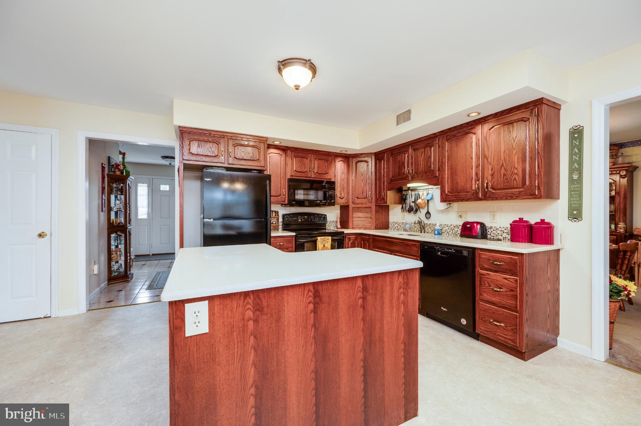 1052 Boeshore Circle Reading, PA 19605 - Photo 31 of 72 a kitchen with granite countertop a refrigerator stove top oven a sink and dishwasher