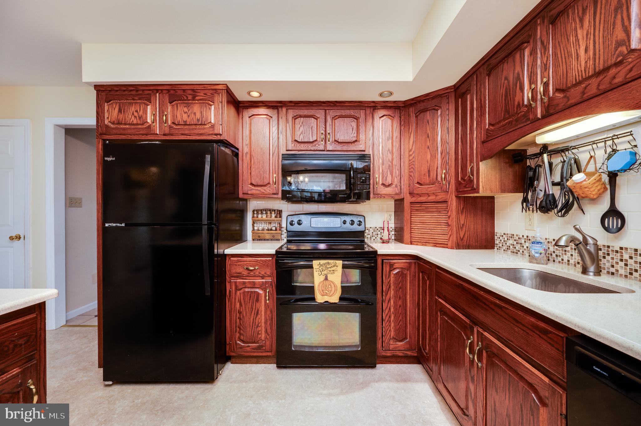 1052 Boeshore Circle Reading, PA 19605 - Photo 35 of 72 a kitchen with stainless steel appliances granite countertop a refrigerator stove and sink