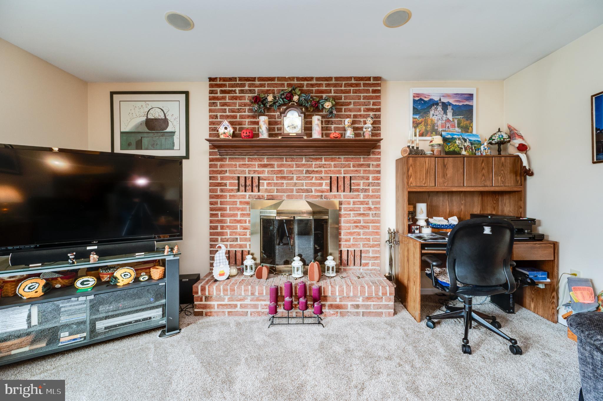 1052 Boeshore Circle Reading, PA 19605 - Photo 43 of 72 a view of a livingroom with workspace and a flat screen tv
