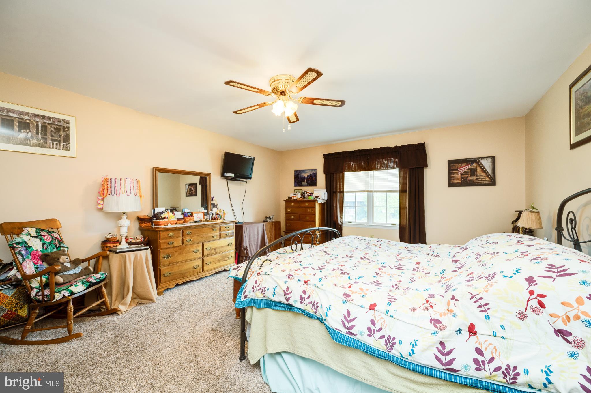 1052 Boeshore Circle Reading, PA 19605 - Photo 50 of 72 a bedroom with a bed and wooden floor