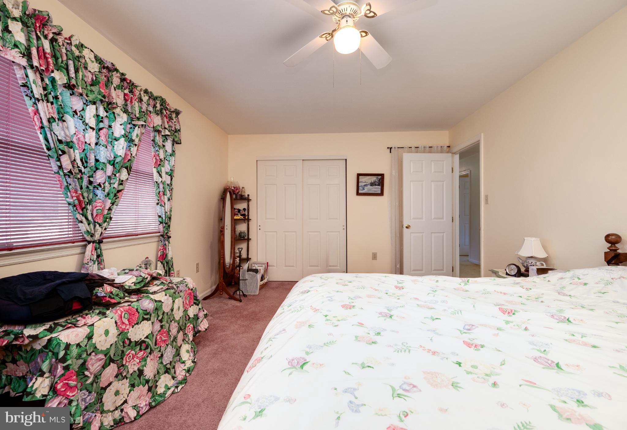 1052 Boeshore Circle Reading, PA 19605 - Photo 51 of 72 a bedroom with bed and a chandelier