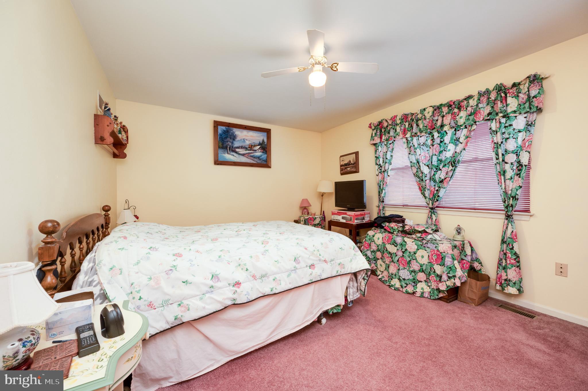 1052 Boeshore Circle Reading, PA 19605 - Photo 53 of 72 a bedroom with a bed and a painting on the wall