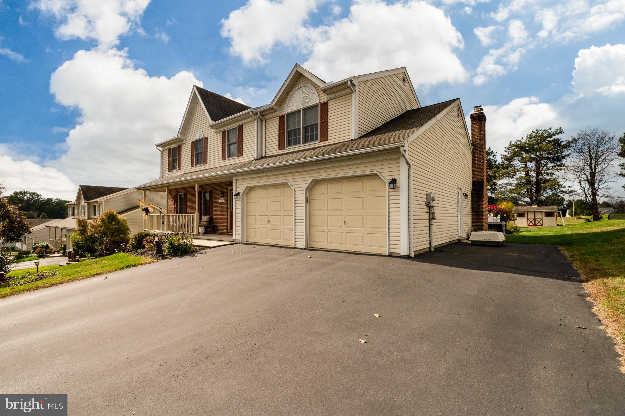 1052 Boeshore Circle Reading, PA 19605 - Photo 8 of 72 a front view of a house with a yard and garage