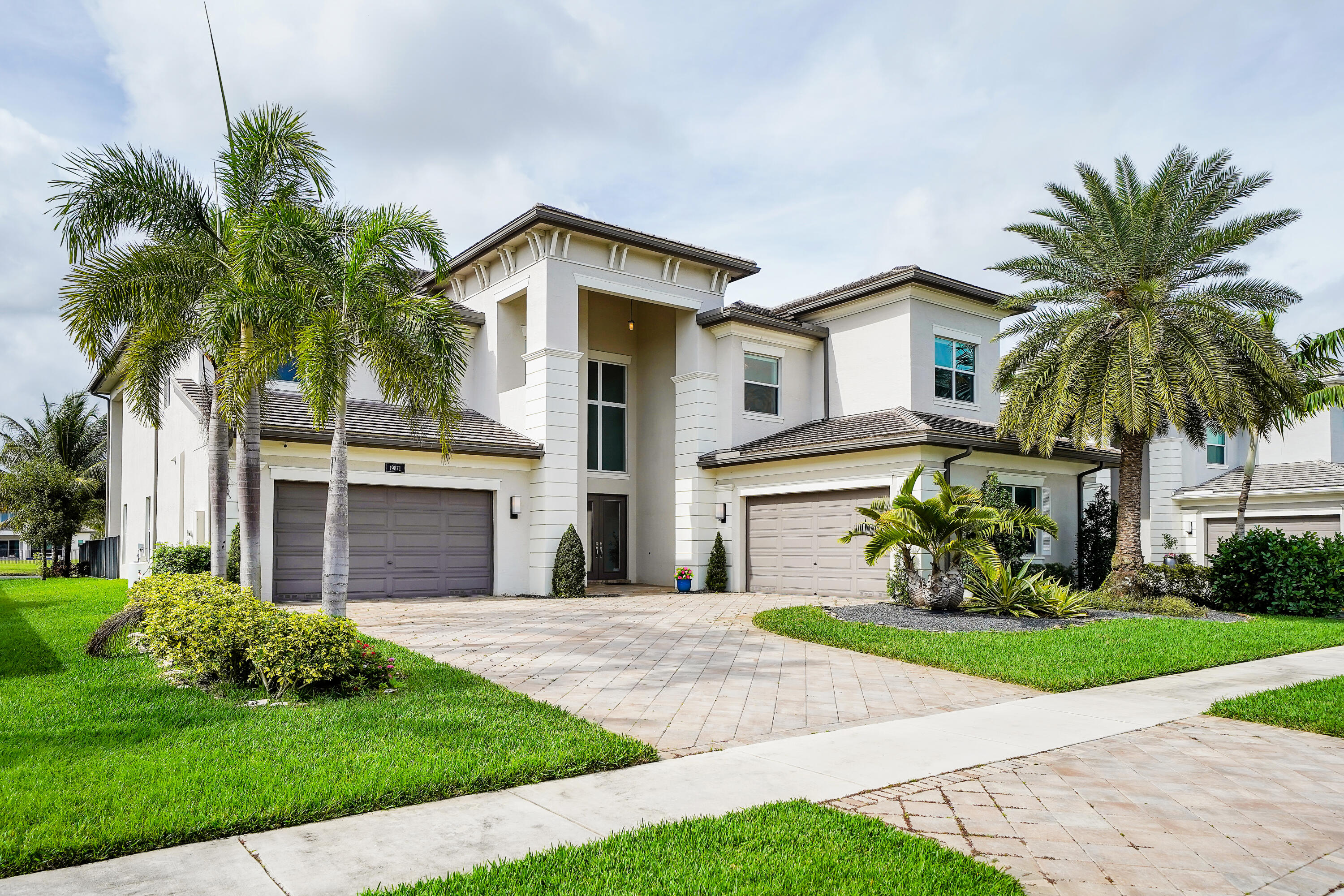 19871 Meadowside Lane Boca Raton, FL 33498 - Photo 3 of 102 a front view of a house with garden and porch