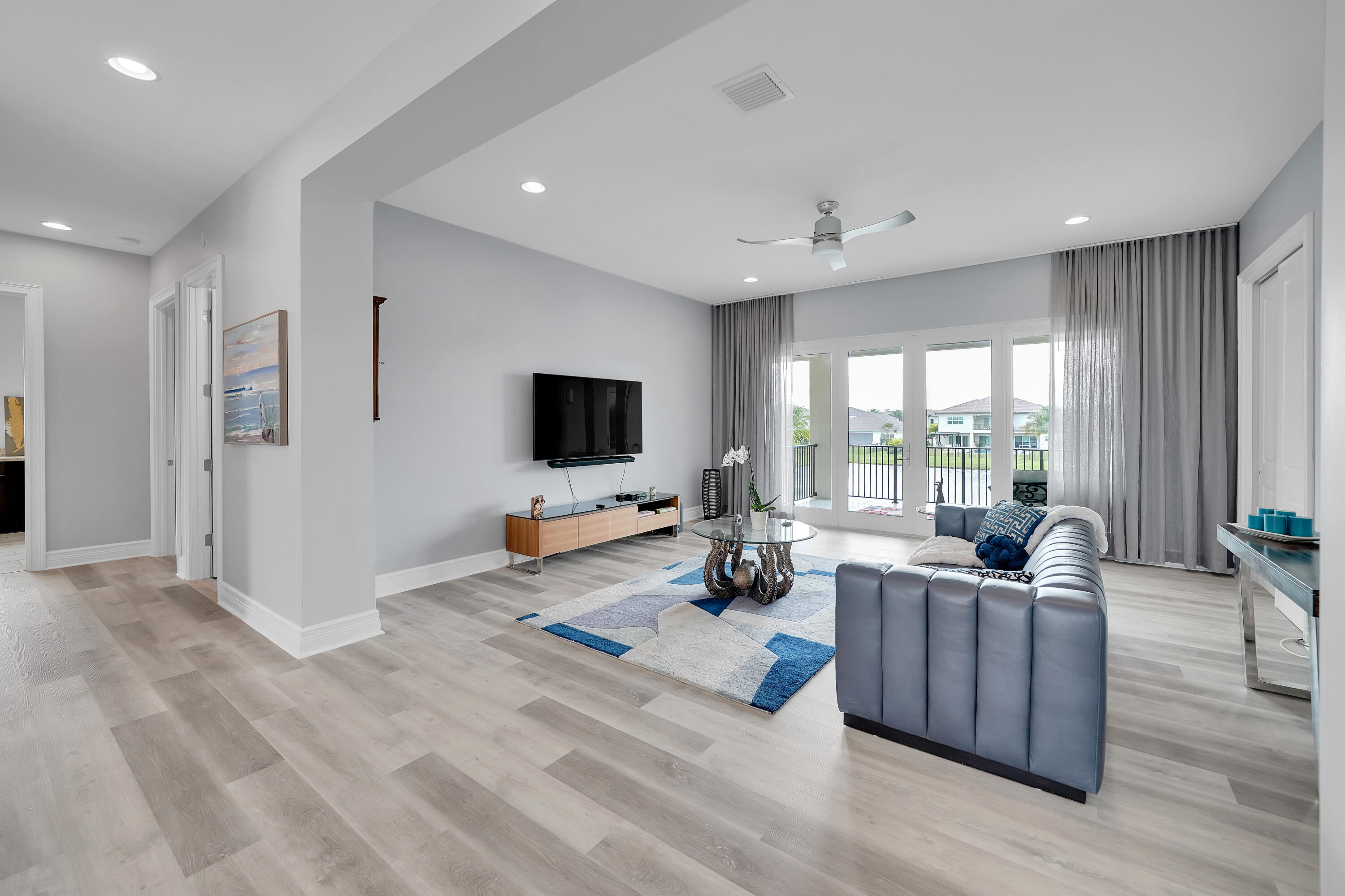 19871 Meadowside Lane Boca Raton, FL 33498 - Photo 31 of 102 a living room with furniture and a flat screen tv