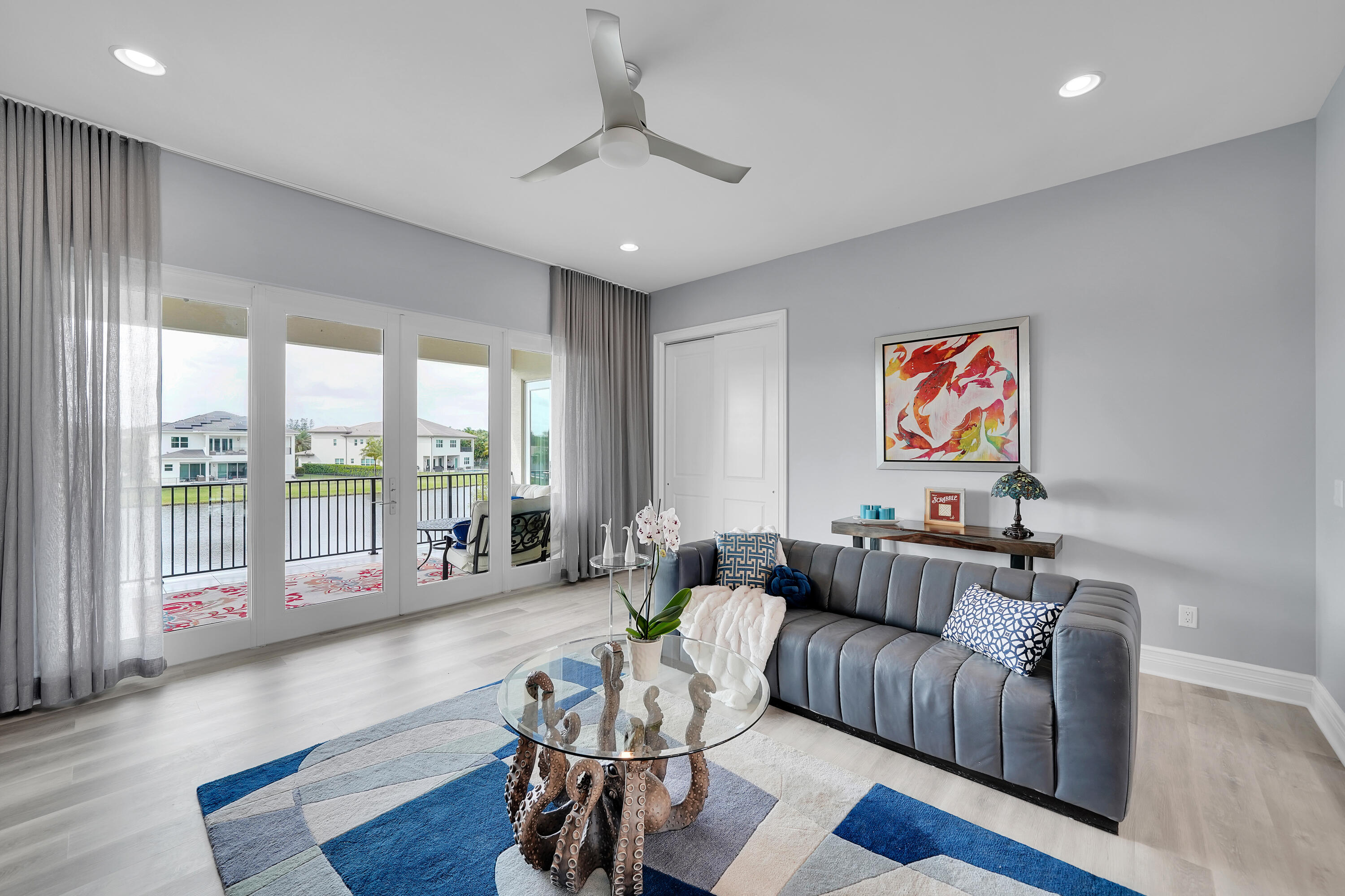 19871 Meadowside Lane Boca Raton, FL 33498 - Photo 32 of 102 a living room with furniture and a large window