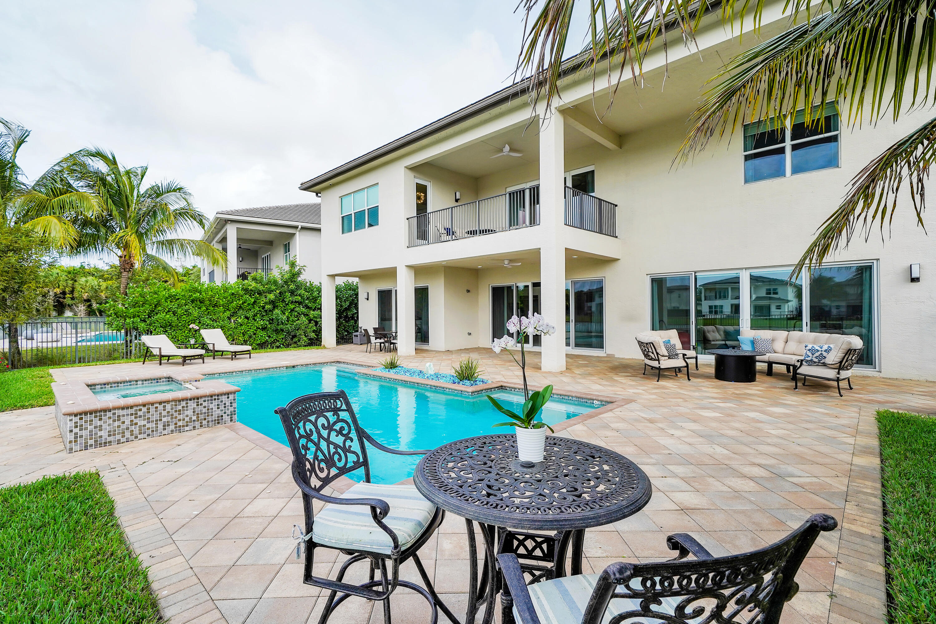 19871 Meadowside Lane Boca Raton, FL 33498 - Photo 5 of 102 a view of a house with swimming pool and sitting area