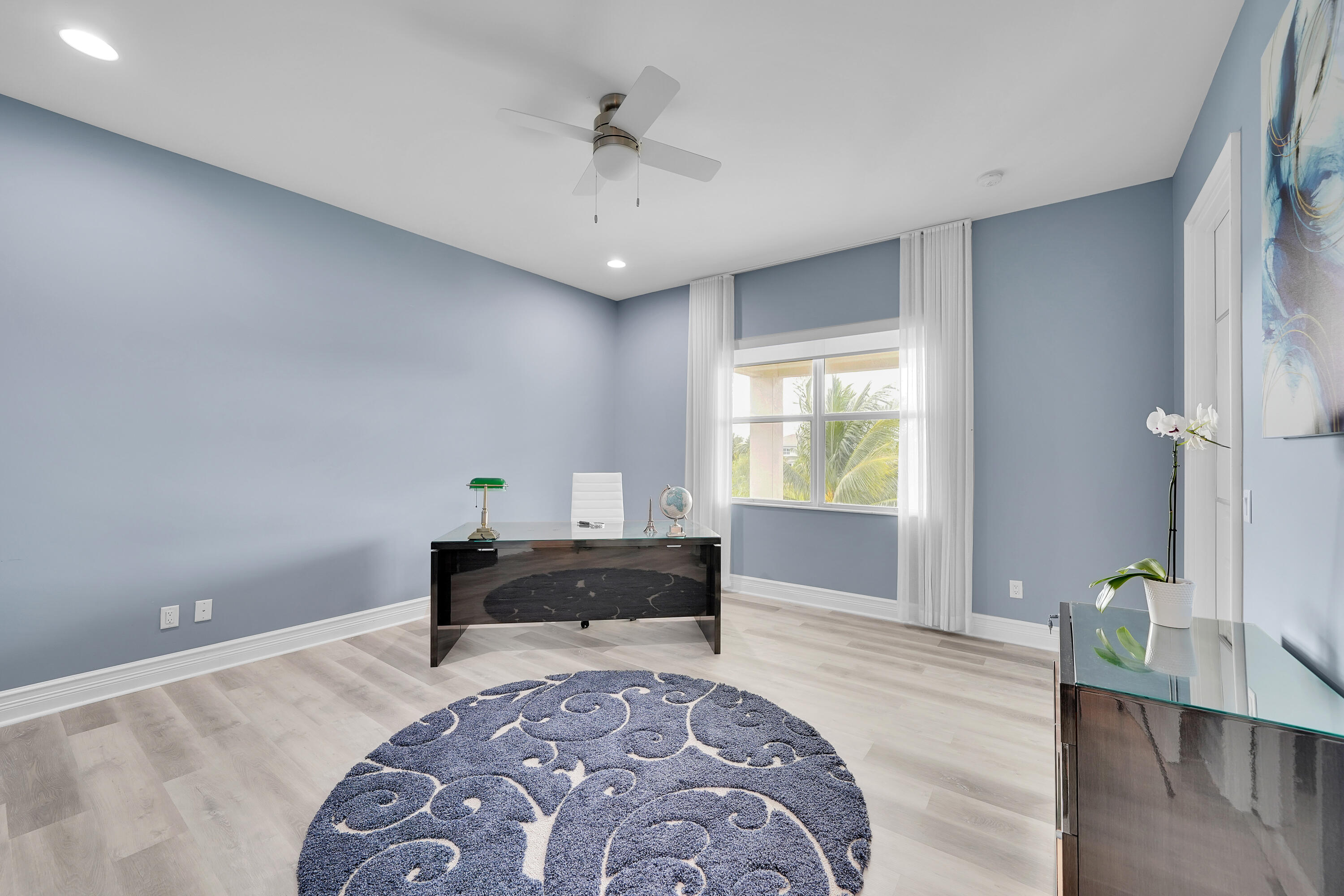 19871 Meadowside Lane Boca Raton, FL 33498 - Photo 57 of 102 a spacious bedroom with a bed and a table in it