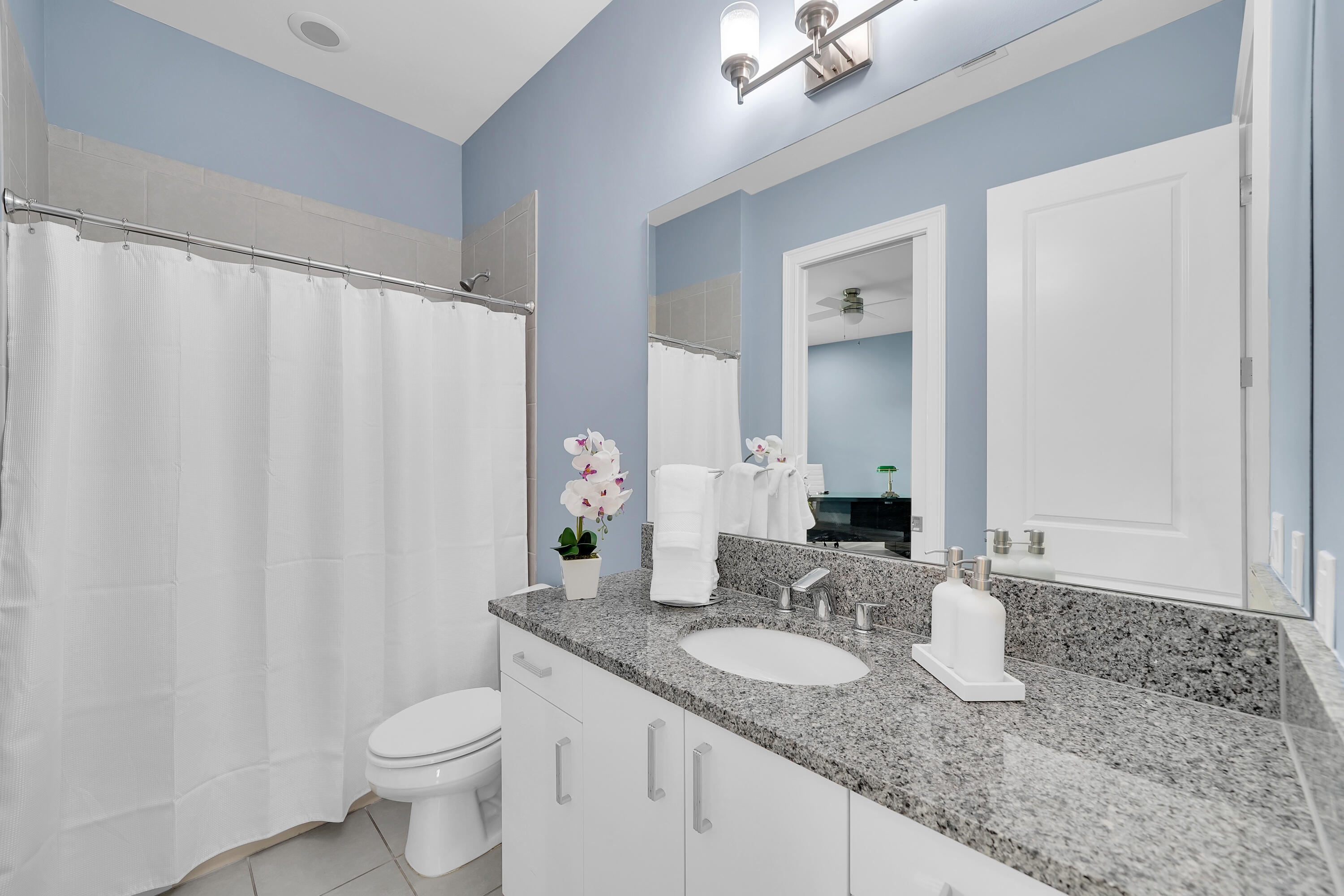 19871 Meadowside Lane Boca Raton, FL 33498 - Photo 61 of 102 a bathroom with a granite countertop sink and a mirror