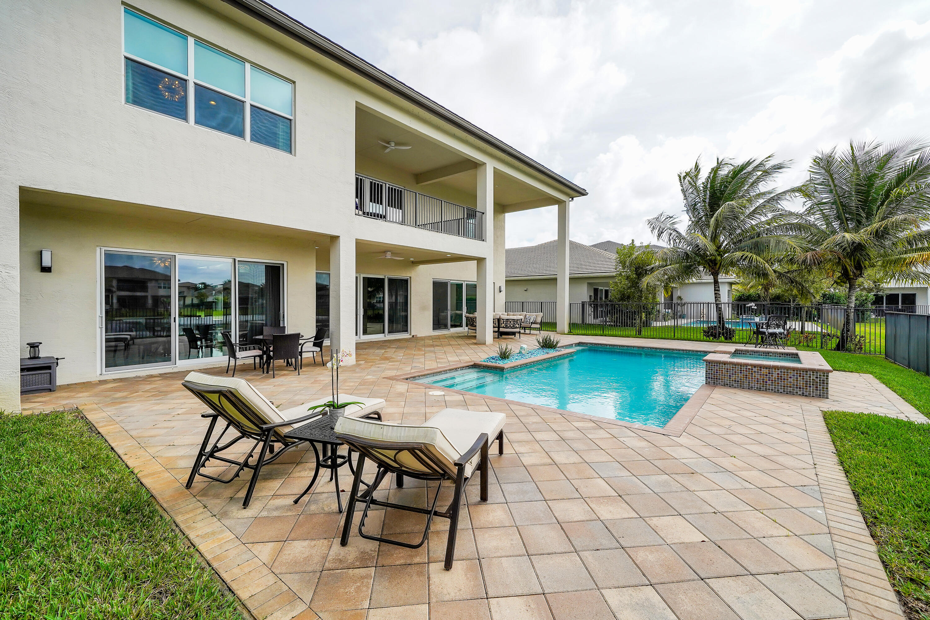 19871 Meadowside Lane Boca Raton, FL 33498 - Photo 71 of 102 a view of a house with swimming pool and sitting area